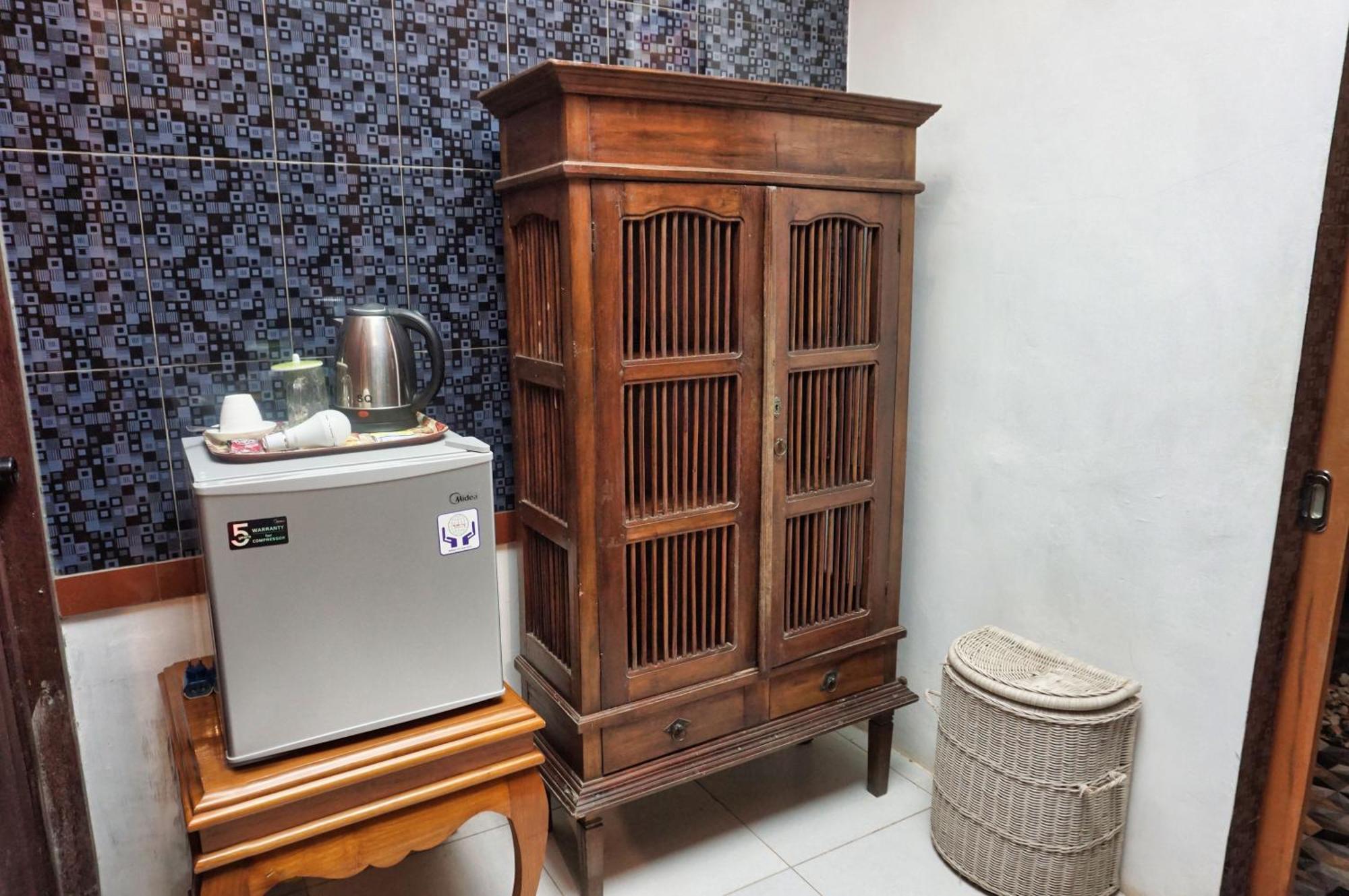 The Wisma Pulau Merah Pasanggaran Phòng bức ảnh